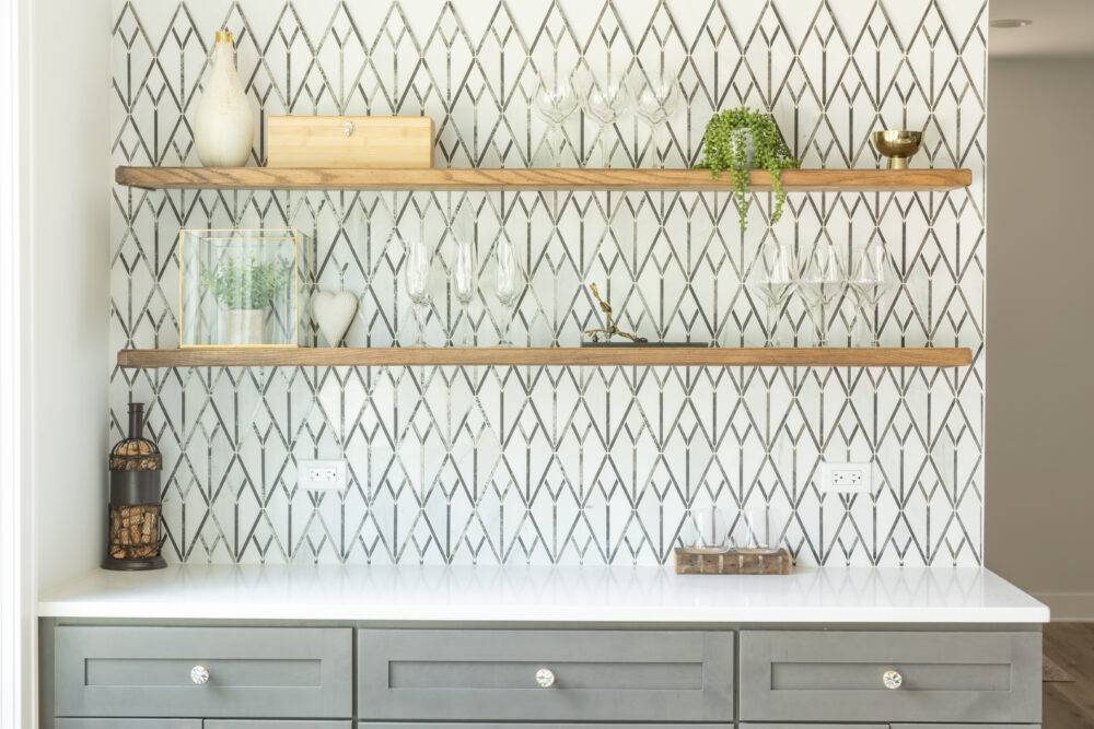 Bar with black and white mosaic tile wall. 