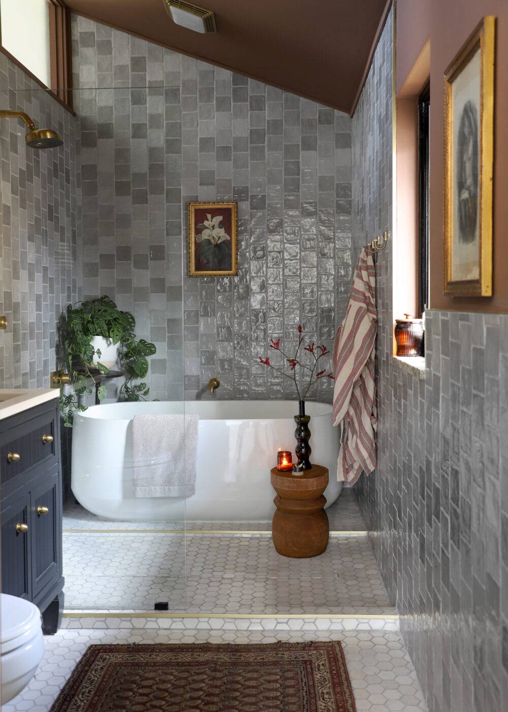 Bathroom with wet room and grey square handmade-look tile. 